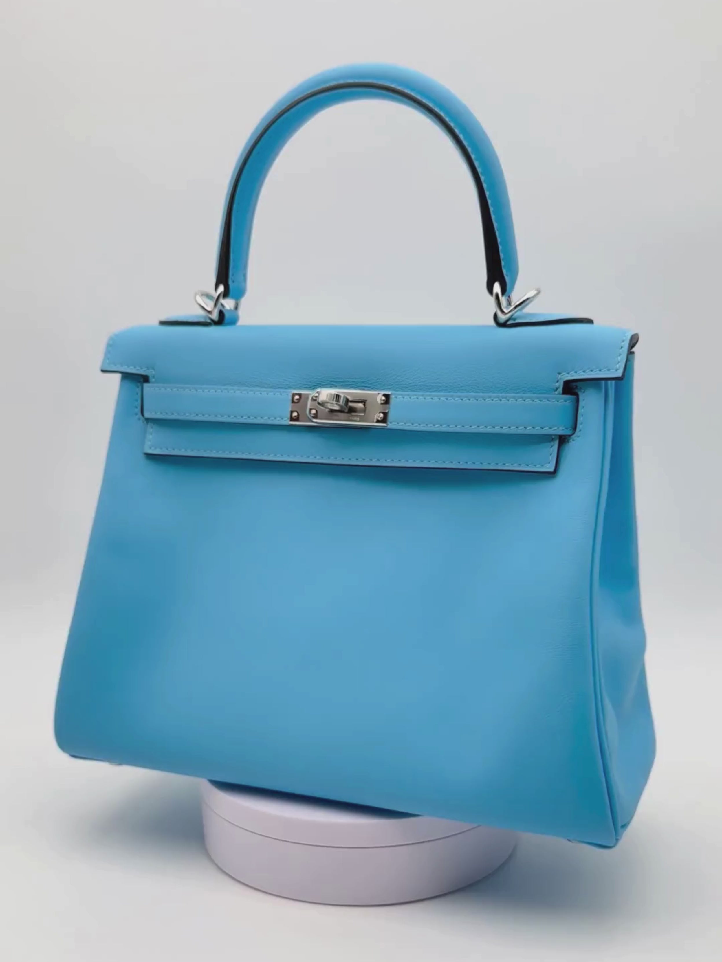 Hermès Kelly 25 Swift Celeste con herrajes de paladio