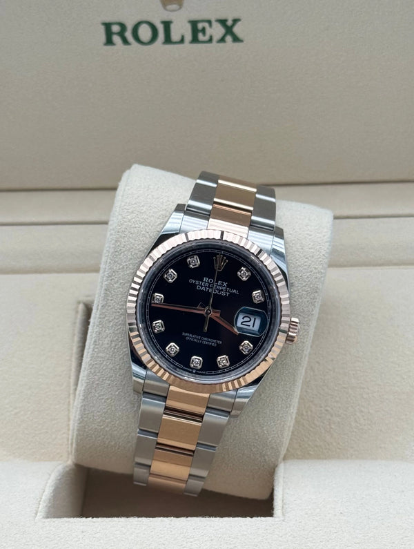 Rolex Datejust 36mm con esfera negra con diamantes, acero y oro rosa, bisel estriado y brazalete Oyster. Año 2021, en muy buen estado, con caja y garantía.